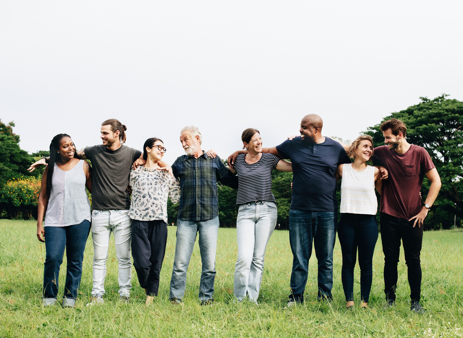 Group of people hugging each other in the park